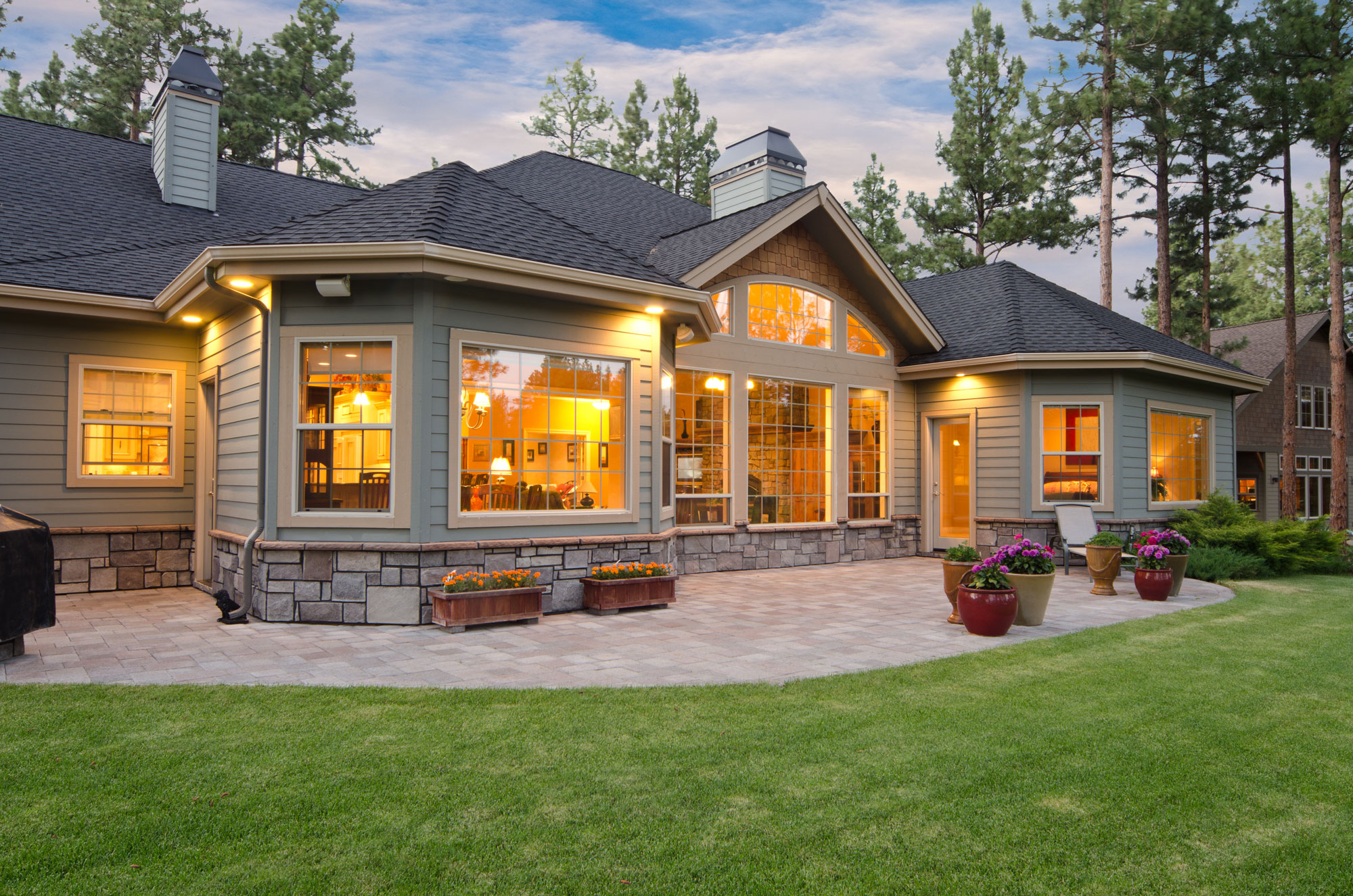 Home-exterior Home Exterior showing a stone patio and landscaped yard
